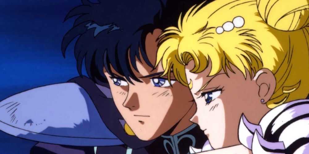 Tuxedo Mask abrazando a Sailor Moon en la película Sailor Moon R La promesa de la rosa.
