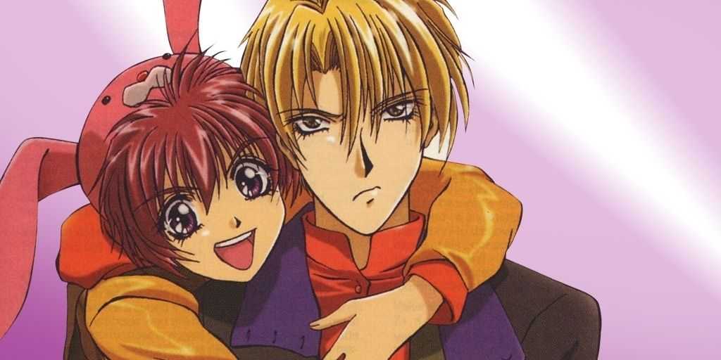 Shuichi Shindou y Eiri Yuki abrazados frente a un fondo rosa brillante en Gravitation.