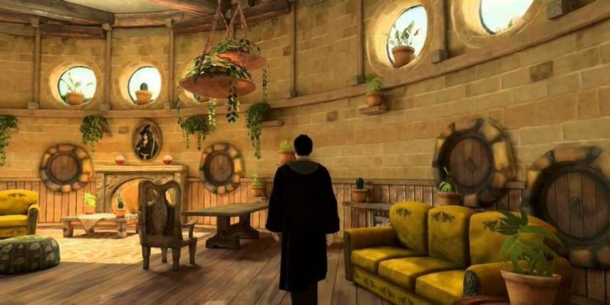 Ein Bild eines Zauberers, der den Hufflepuff-Gemeinschaftsraum in Hogwarts Legacy erkundet